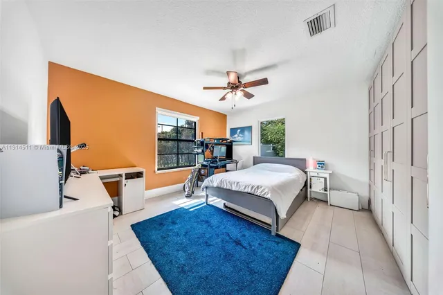 a aerial view of a house with a yard table and chairs