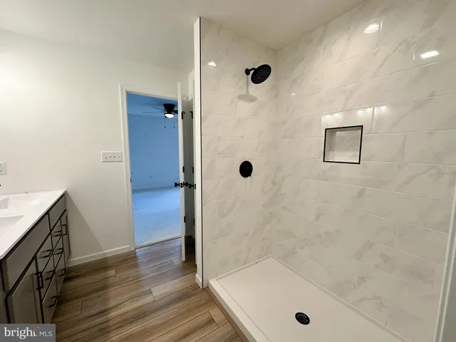 a bathroom with a tub and shower