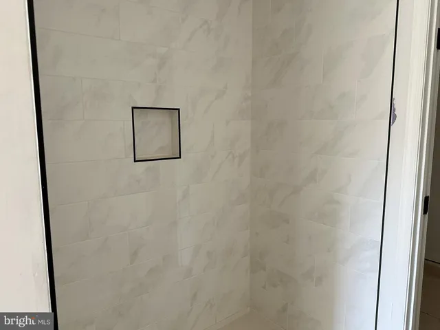 a picture of a wall with a shower