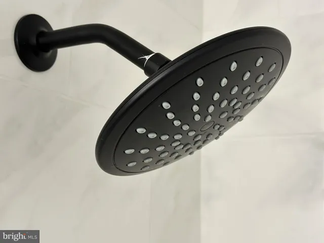 a close view of a utility room with dryer and washer