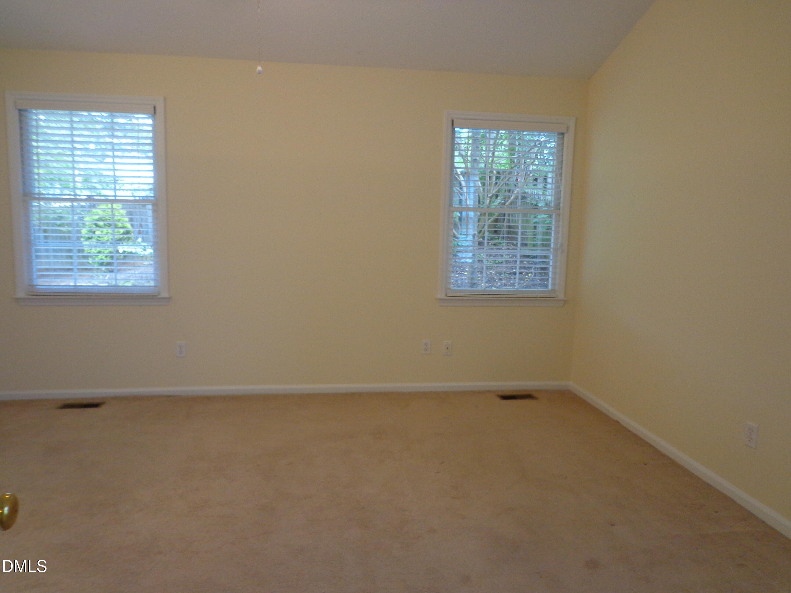 113 Tapestry Terrace Cary, NC 27511 - Photo 6 of 8 an empty room with a window