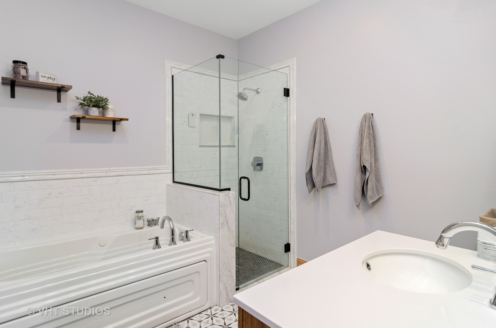 1137 West Addison Street, Unit 2 Chicago, IL 60613 - Photo 12 of 19 a bathroom with a tub sink and mirror
