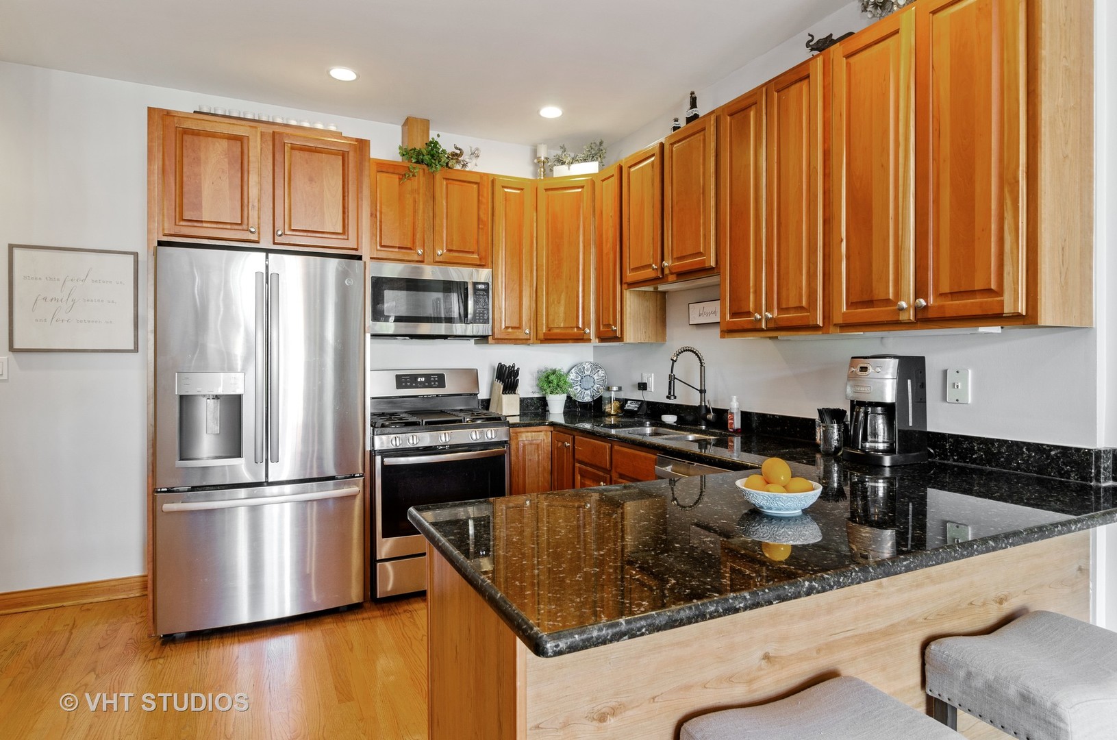 1137 West Addison Street, Unit 2 Chicago, IL 60613 - Photo 18 of 19 a kitchen with stainless steel appliances granite countertop a refrigerator sink and stove