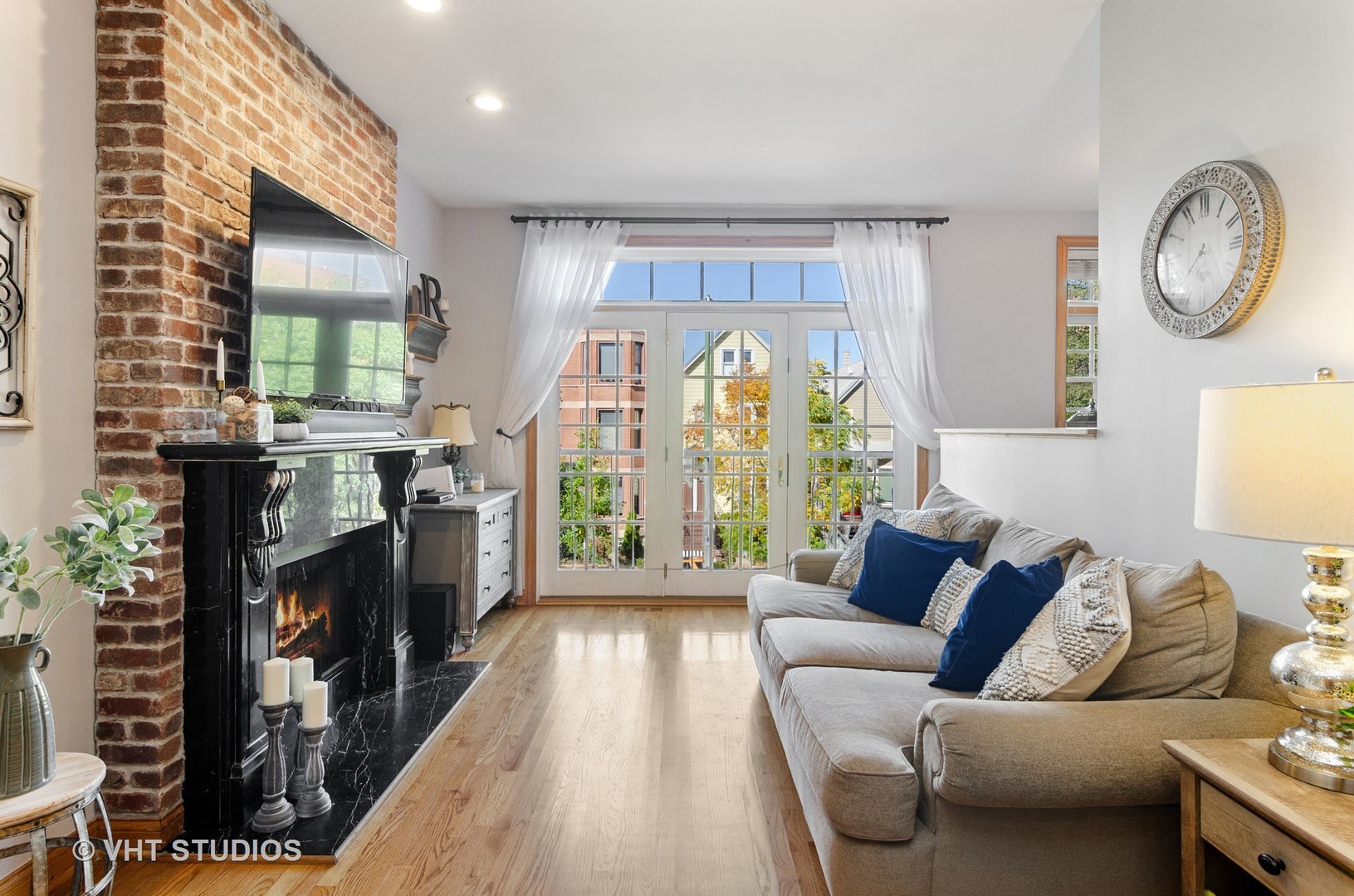 1137 West Addison Street, Unit 2 Chicago, IL 60613 - Photo 5 of 19 a living room with furniture and a fireplace