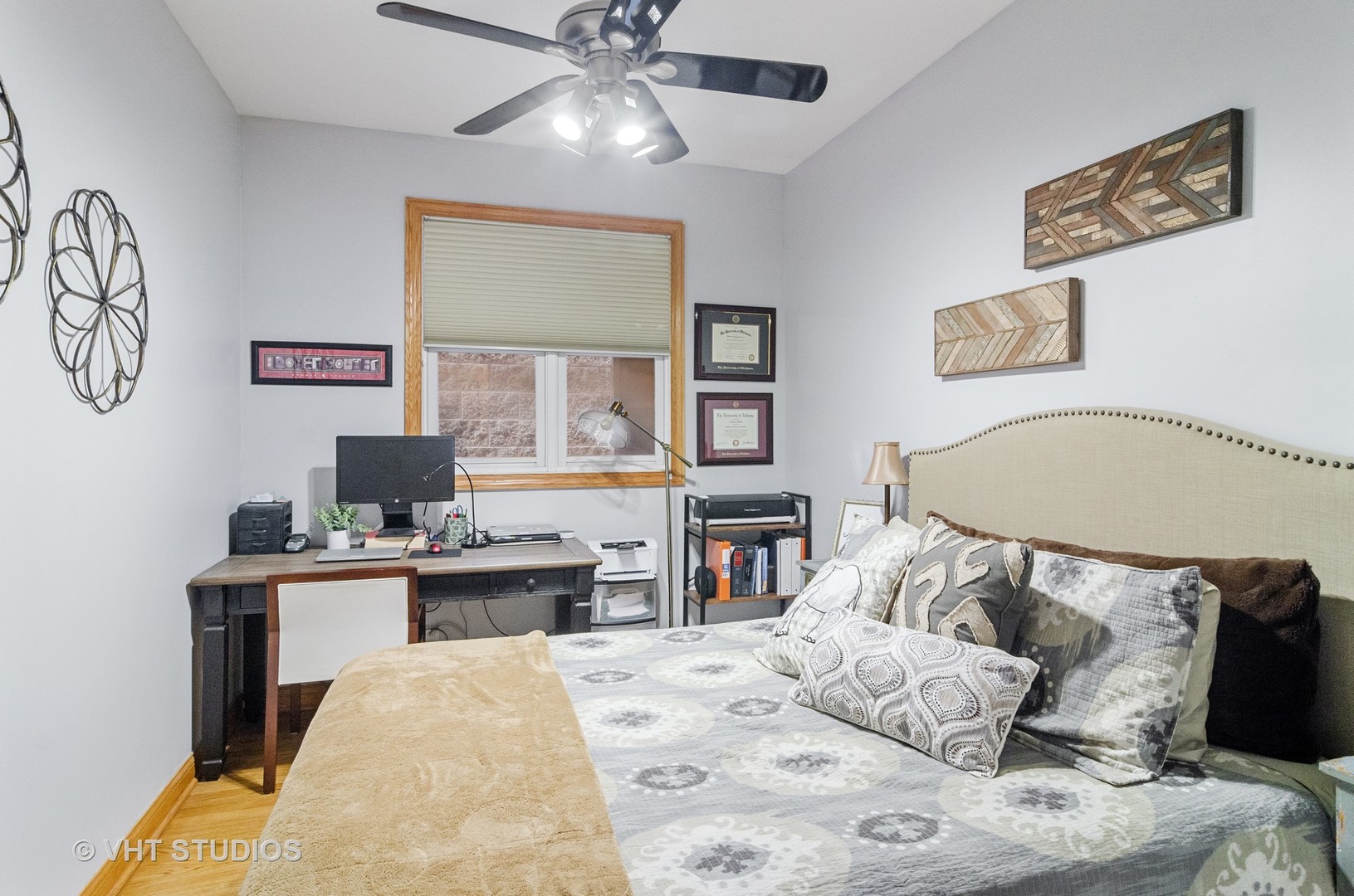 1137 West Addison Street, Unit 2 Chicago, IL 60613 - Photo 8 of 19 a bed room with a bed and a chandelier