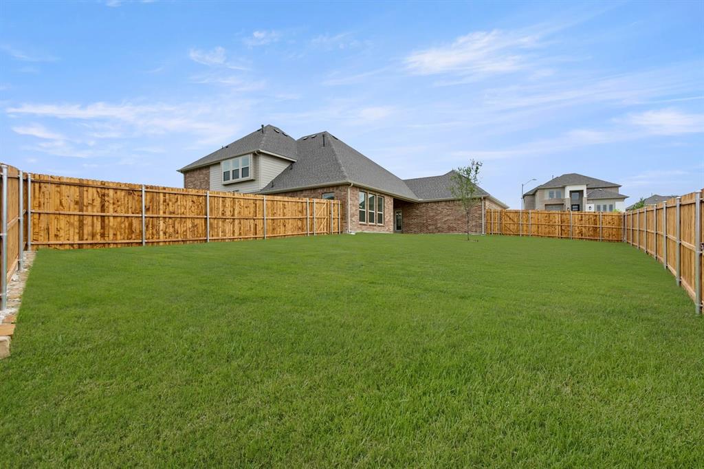 413 Tower Street DeSoto, TX 75115 - Photo 28 of 30 a view of a house with a big yard and large trees