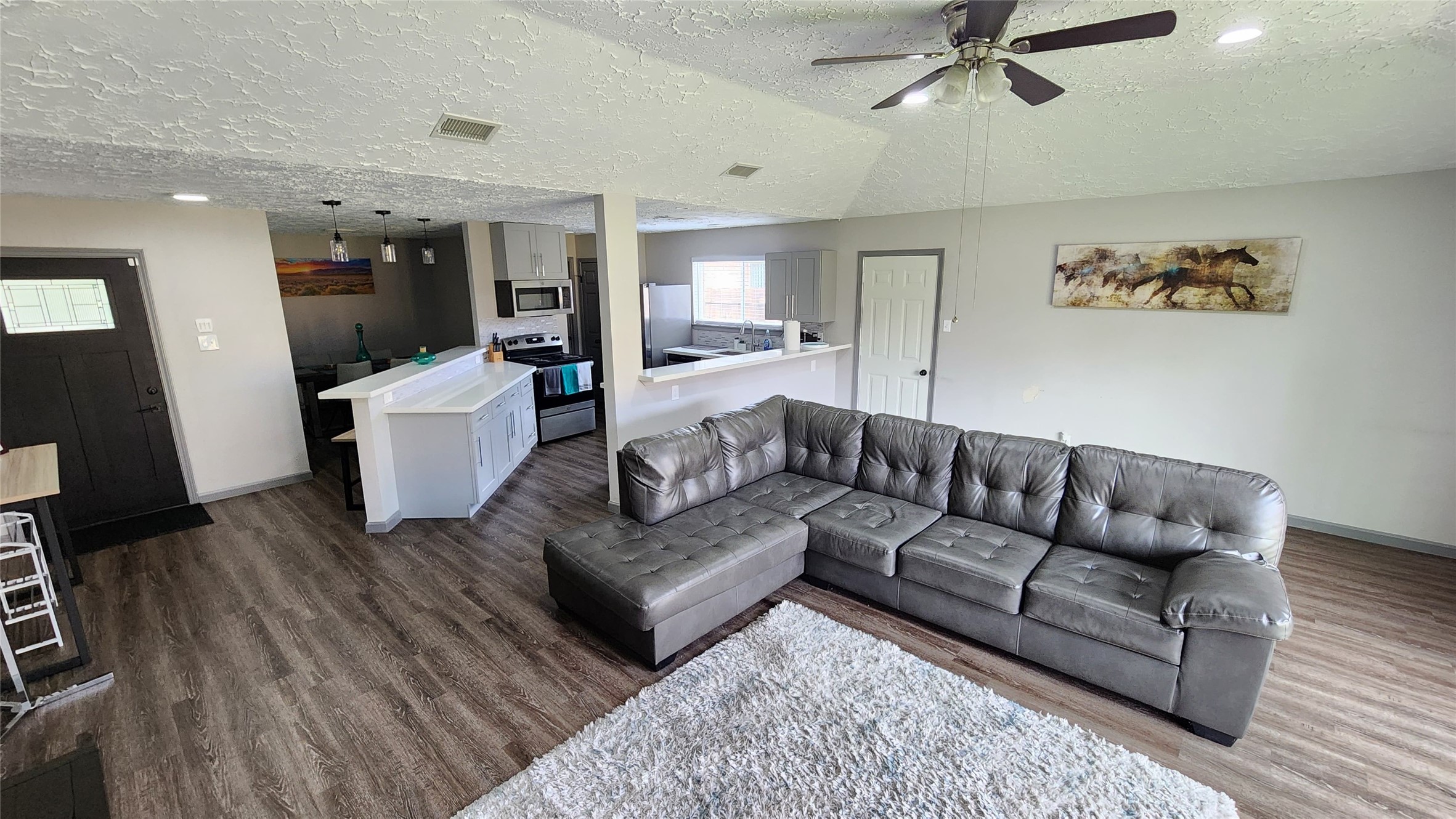 9735 Stonemont Road La Porte, TX 77571 - Photo 3 of 11 a living room with furniture and a wooden floor
