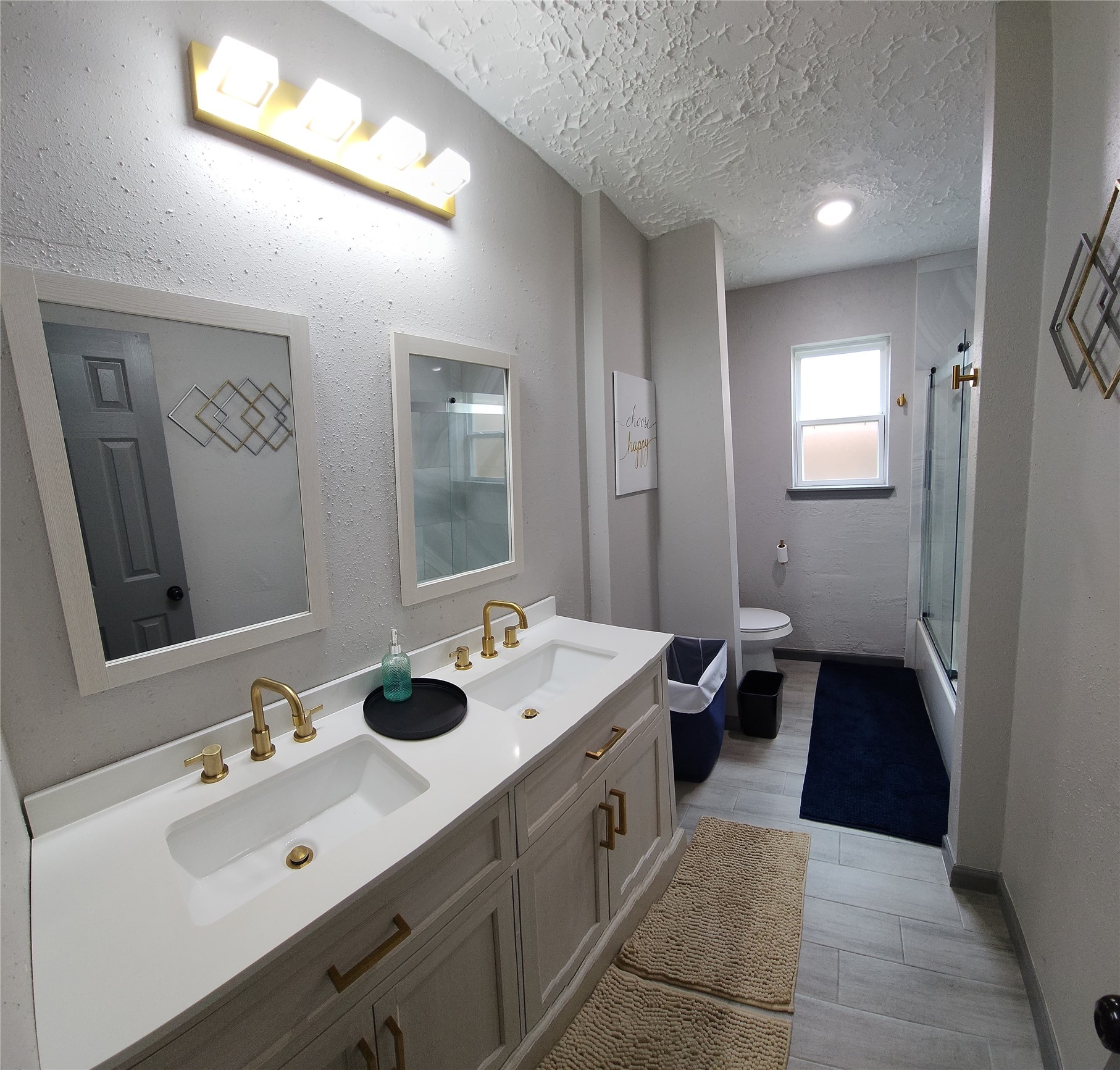 9735 Stonemont Road La Porte, TX 77571 - Photo 6 of 11 a spacious bathroom with a double vanity sink and mirror