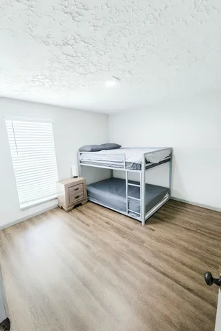 a bathroom with a double vanity sink and mirror