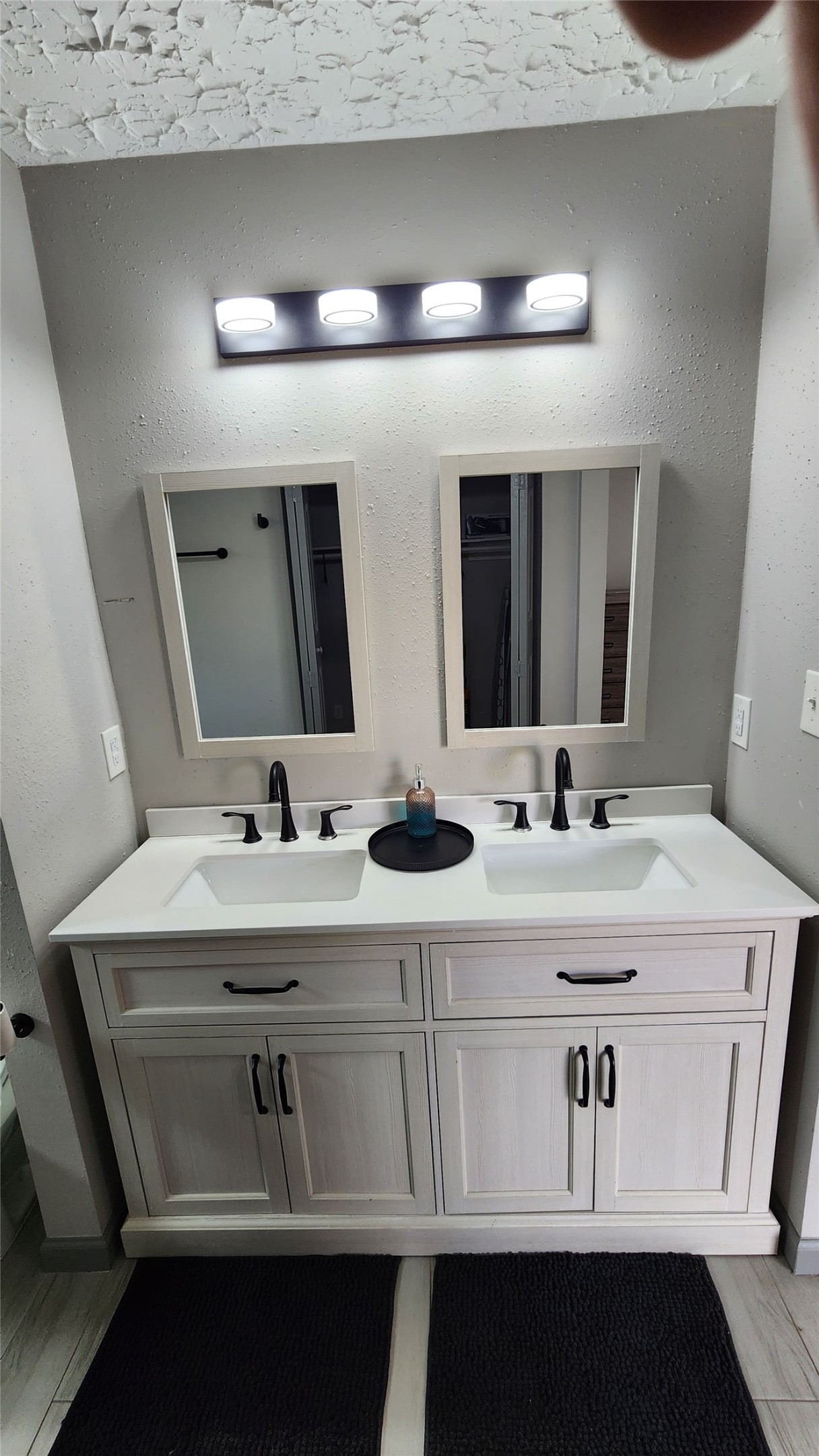 9735 Stonemont Road La Porte, TX 77571 - Photo 9 of 11 a bathroom with a double vanity sink and mirror