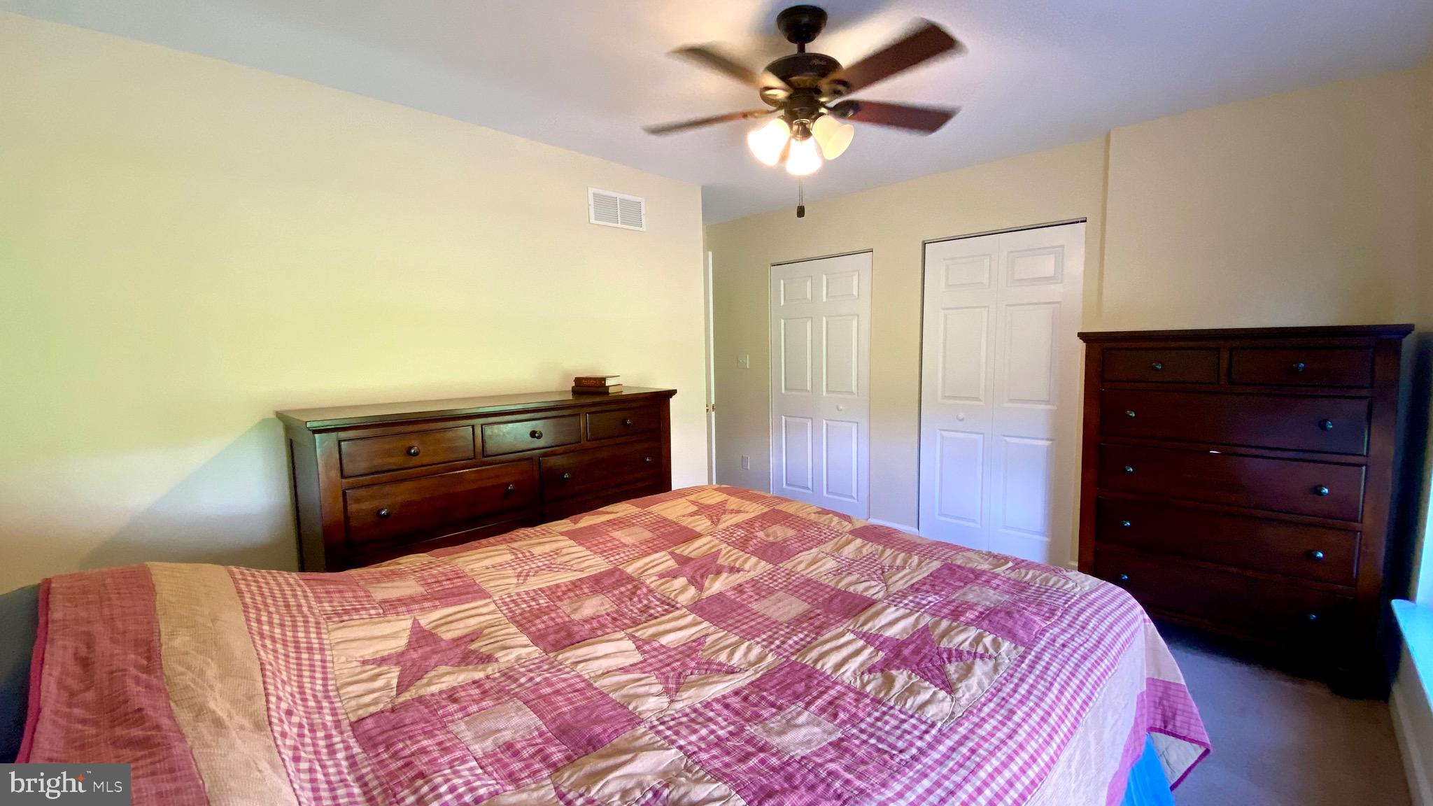 274 Hitching Post Drive Rising Sun, MD 21911 - Photo 12 of 29 a bedroom with a bed and a dresser