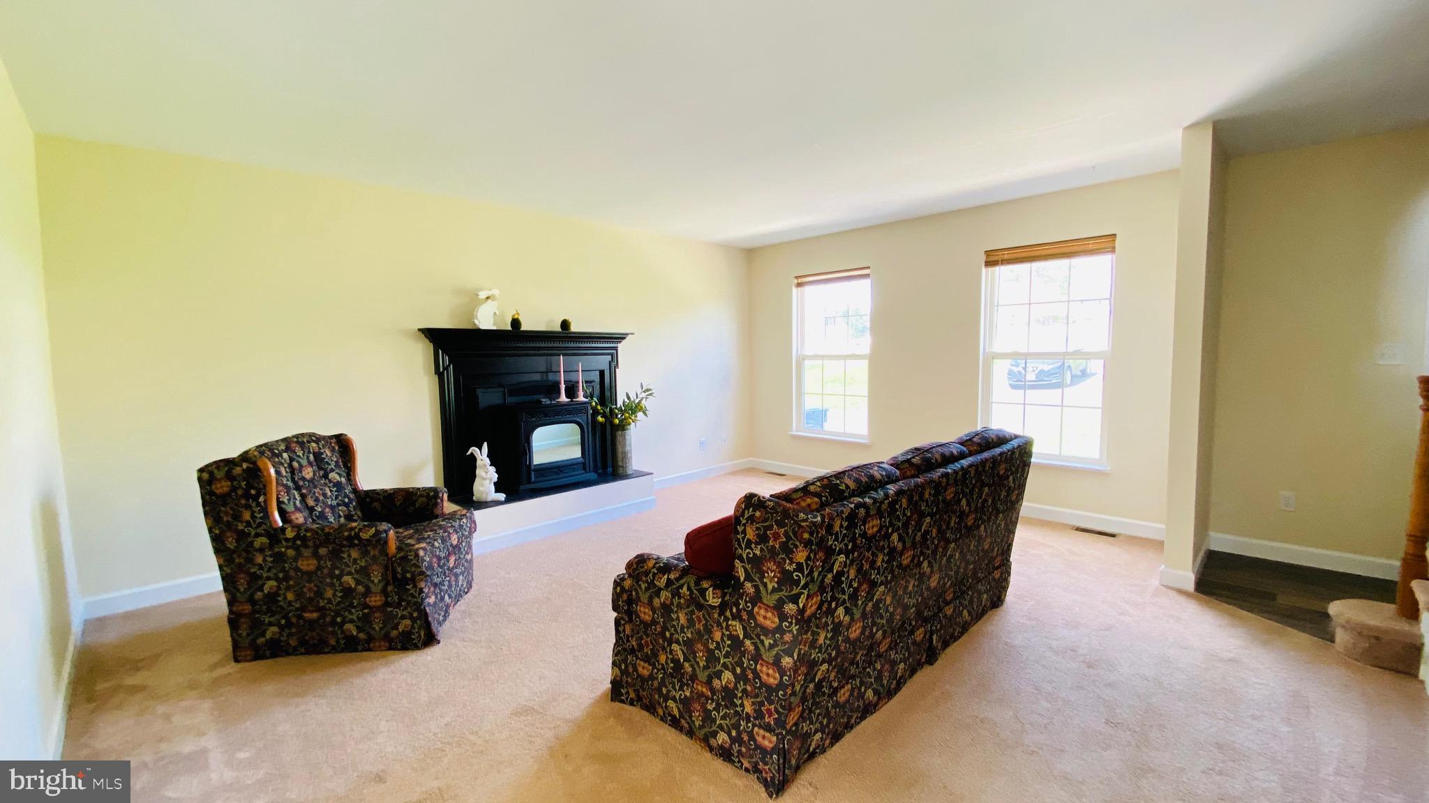 274 Hitching Post Drive Rising Sun, MD 21911 - Photo 2 of 29 a living room with furniture and a fireplace