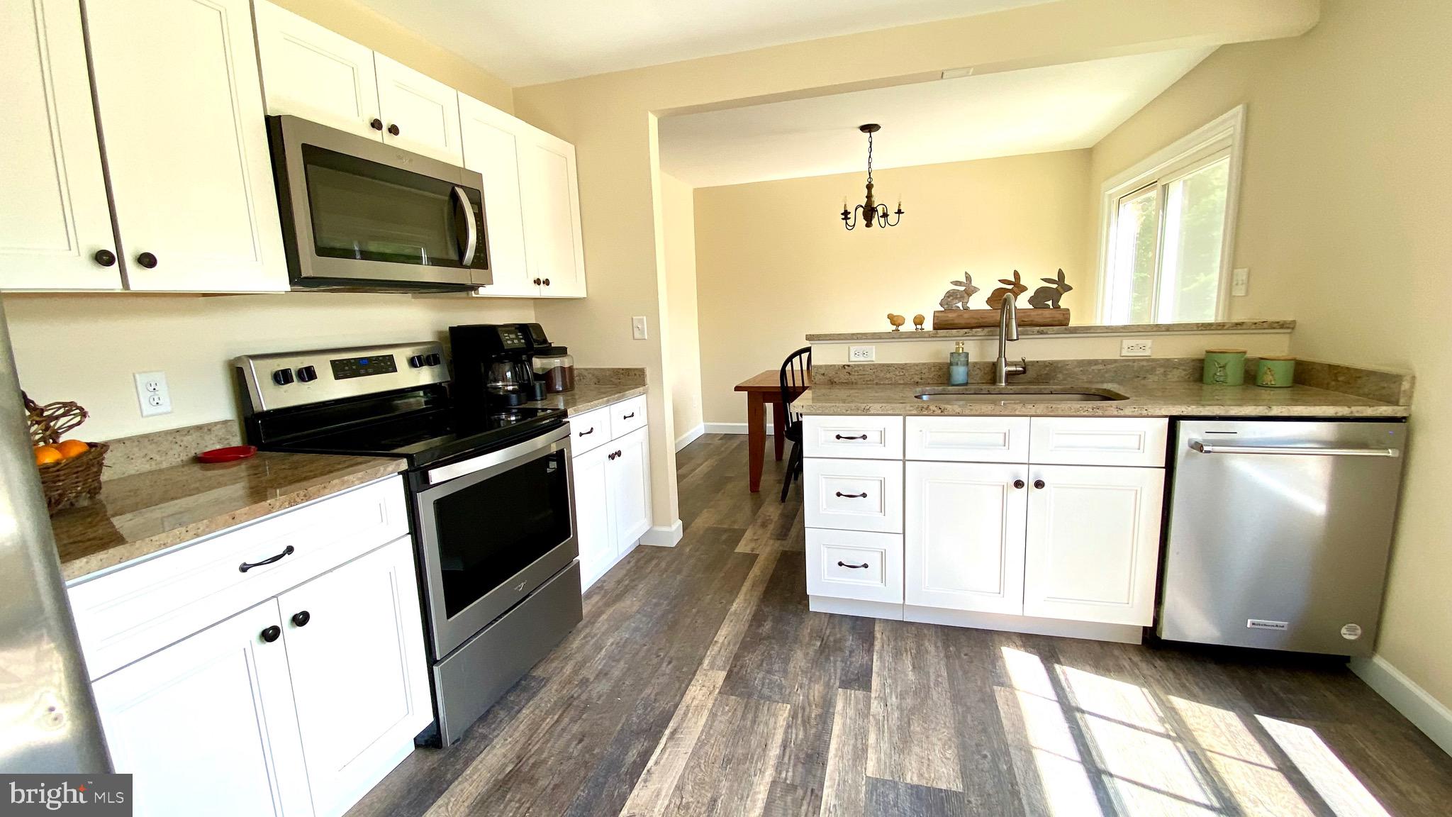 274 Hitching Post Drive Rising Sun, MD 21911 - Photo 6 of 29 a kitchen with a sink stove and microwave