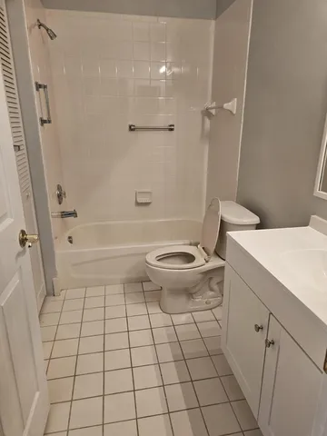 a bathroom with a sink a toilet and a shower