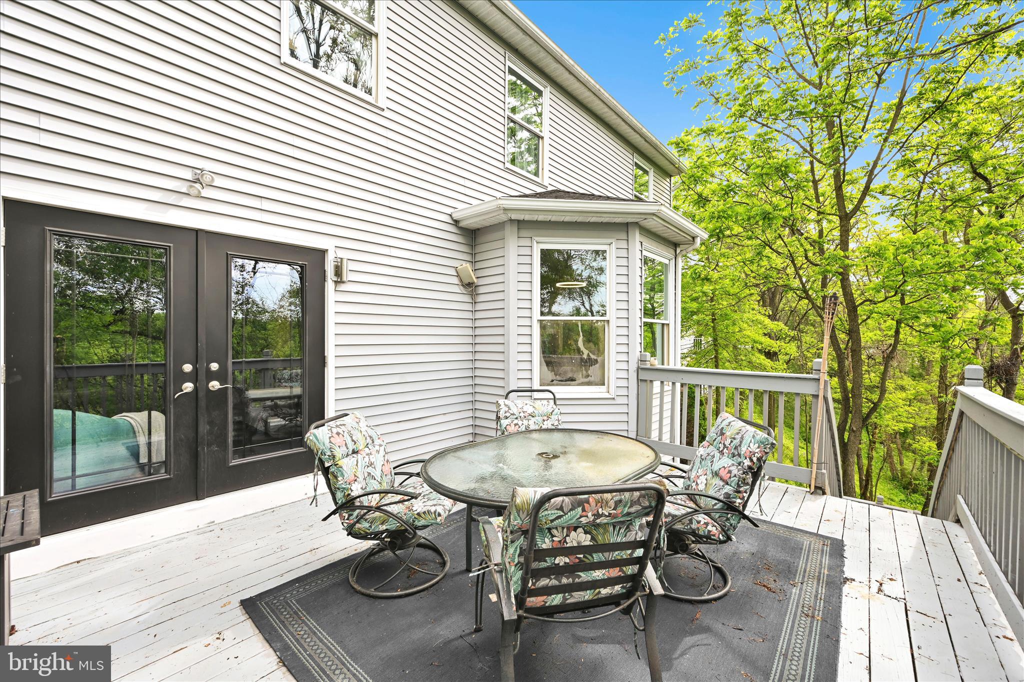 1602 Churchill Road Harrisburg, PA 17111 - Photo 47 of 61 a view of a patio with table and chairs with wooden floor and fence