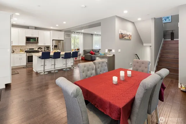 a view of a dining room with furniture window and wooden floor