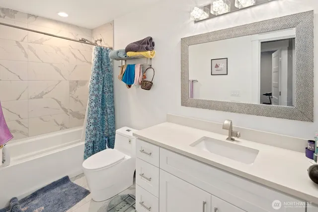 a view of a livingroom with workspace and a window