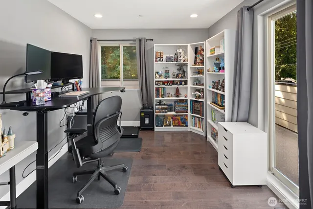 a bathroom with a sink vanity mirror bathtub and toilet
