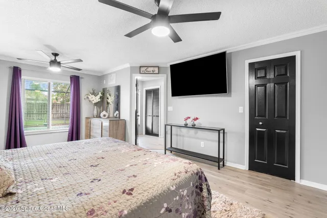 a spacious bathroom with a shower a sink and a mirror