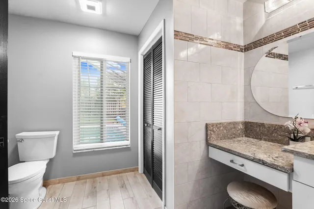 a living room with furniture a window and a chandelier