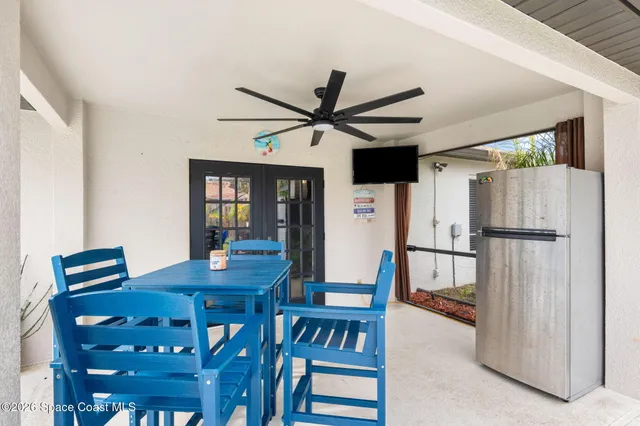 a view of yard with swimming pool and sitting area