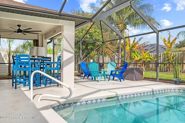 an aerial view of residential houses with outdoor space and street view