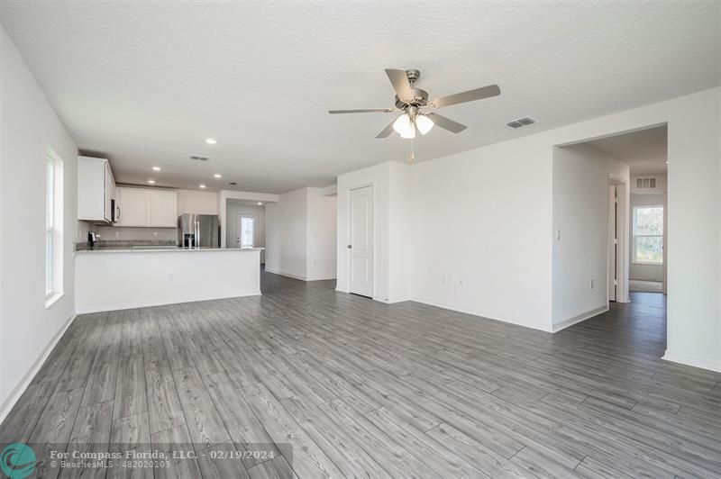5236 Imagination Drive Fort Pierce, FL 34947 - Photo 6 of 19 a view of a kitchen with wooden floor and a kitchen