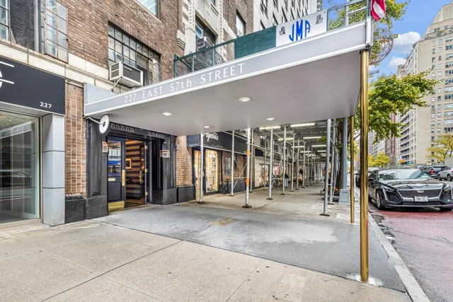 a view of a building with car parked