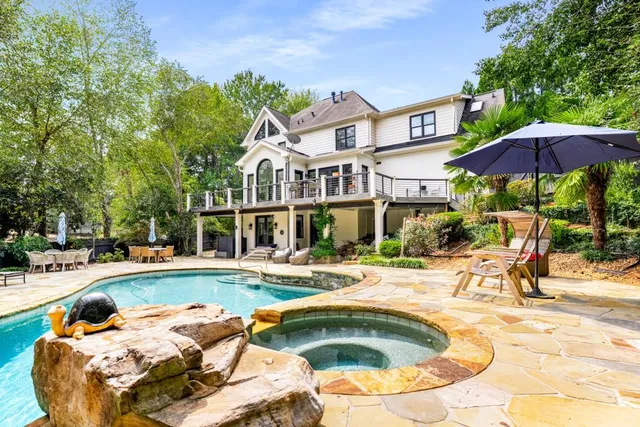 a view of a swimming pool with a lounge chairs