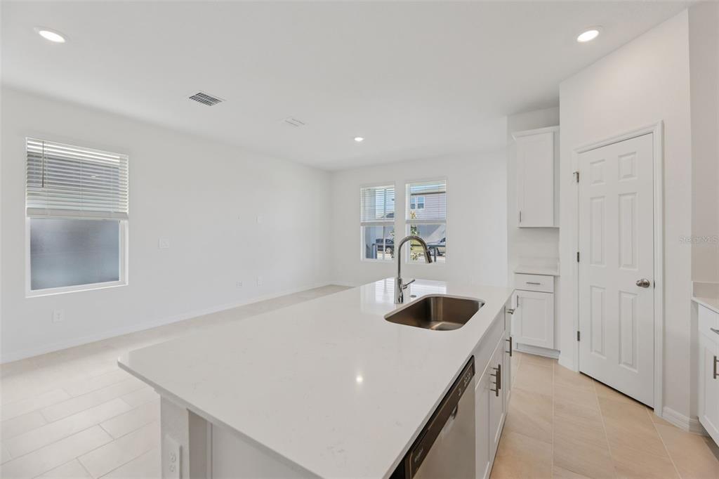 4574 Homestead Trail St. Cloud, FL 34772 - Photo 12 of 31 a kitchen with a sink and cabinets