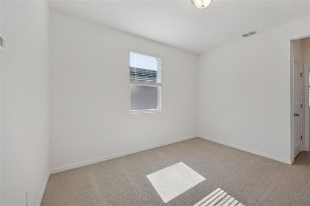 4574 Homestead Trail St. Cloud, FL 34772 - Photo 16 of 31 an empty room with windows