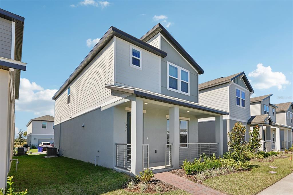 4574 Homestead Trail St. Cloud, FL 34772 - Photo 2 of 31 a front view of a house with a yard