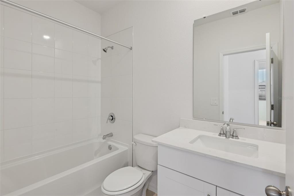 4574 Homestead Trail St. Cloud, FL 34772 - Photo 22 of 31 a bathroom with a sink toilet and bathtub