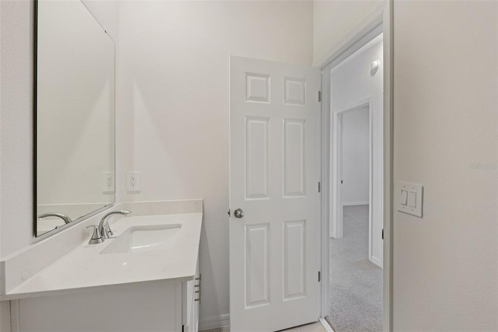4574 Homestead Trail St. Cloud, FL 34772 - Photo 23 of 31 a bathroom with a sink and a mirror