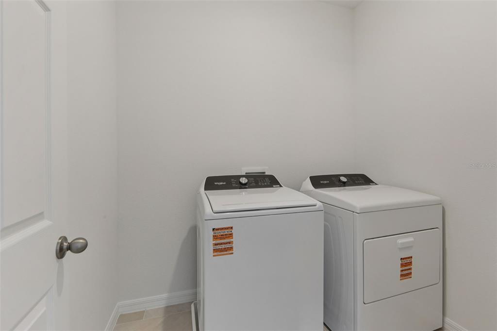 4574 Homestead Trail St. Cloud, FL 34772 - Photo 24 of 31 a utility room with dryer and washer