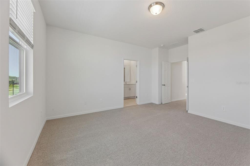 4574 Homestead Trail St. Cloud, FL 34772 - Photo 26 of 31 an empty room with windows and closet