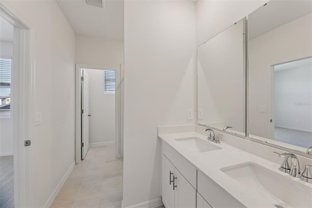 4574 Homestead Trail St. Cloud, FL 34772 - Photo 27 of 31 a bathroom with a sink and a mirror