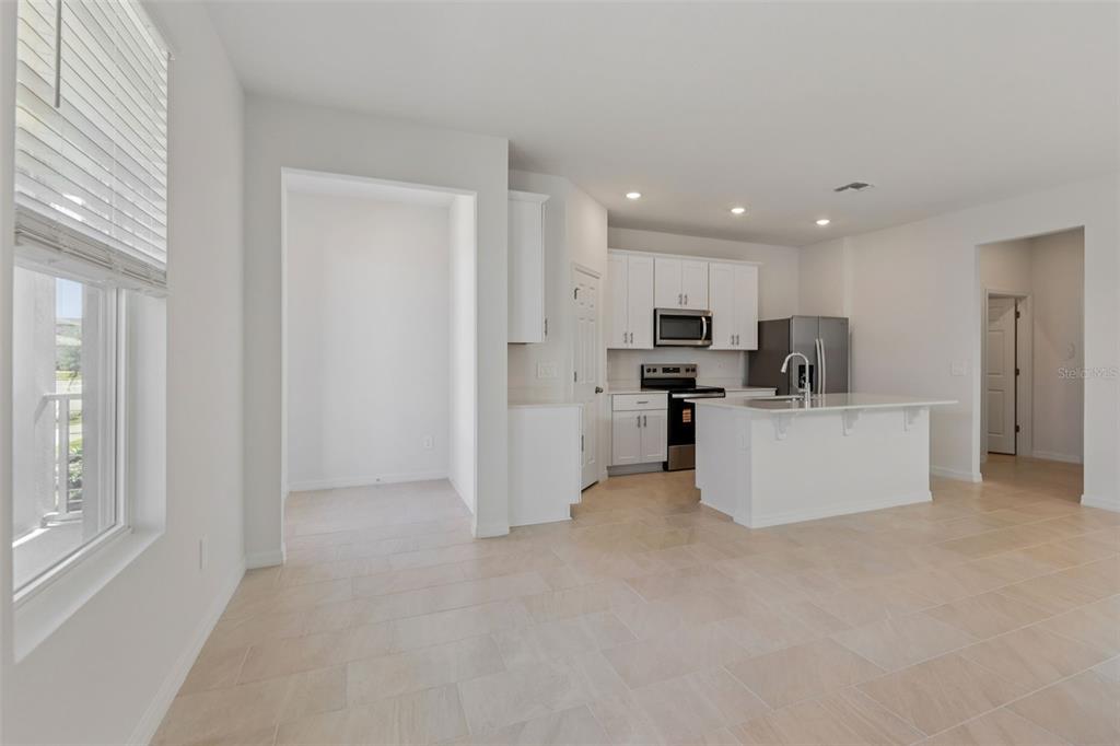 4574 Homestead Trail St. Cloud, FL 34772 - Photo 8 of 31 a view of kitchen with kitchen island stainless steel appliances a sink and cabinets