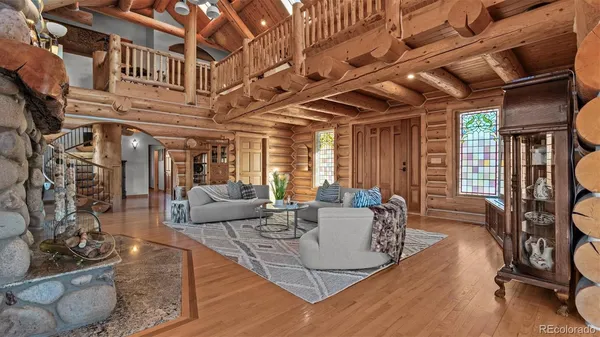 a view of a livingroom with furniture window and wooden floor
