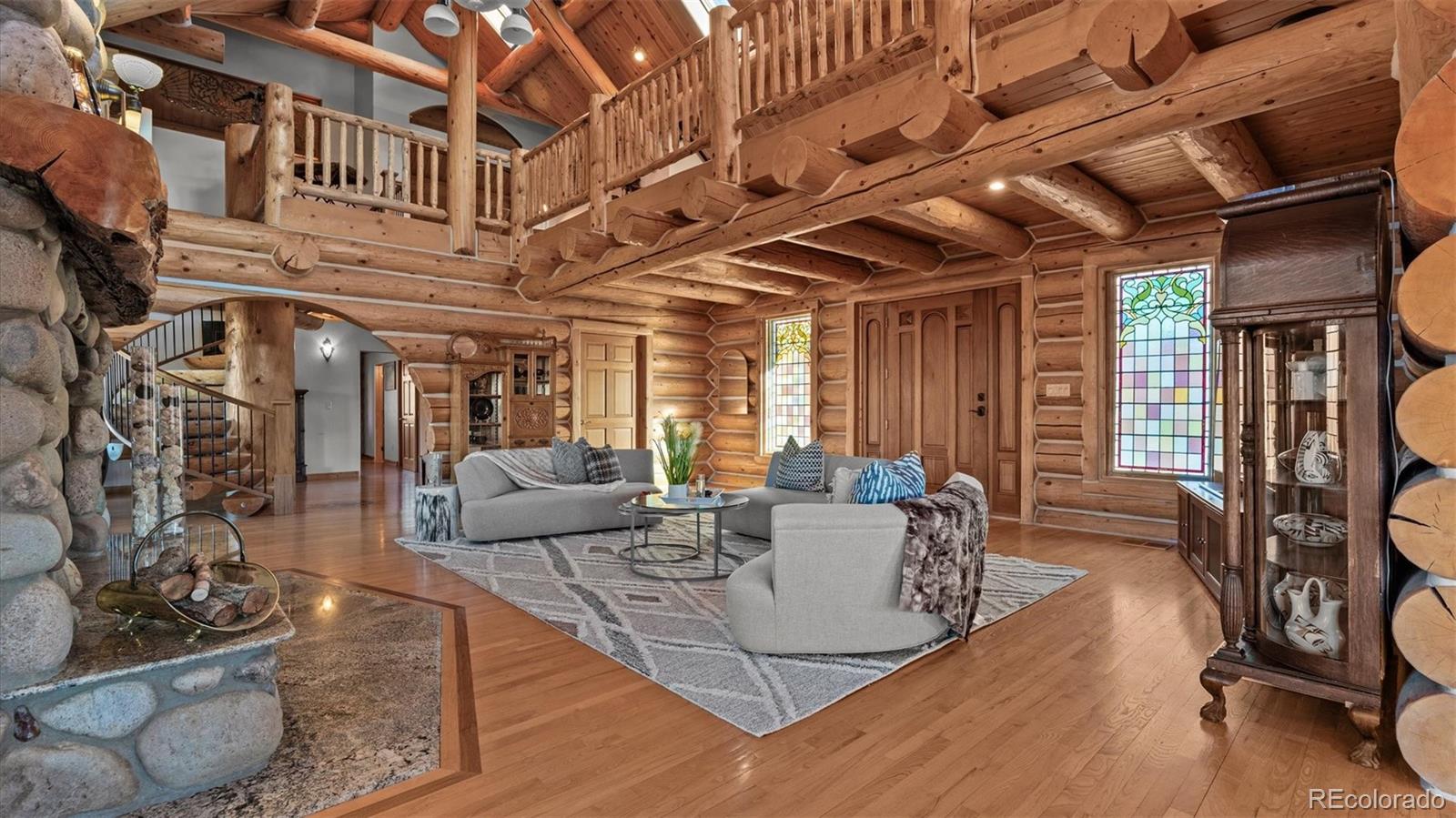 3875 F F 3/4 Road Palisade, CO 81526 - Photo 13 of 45 a view of a livingroom with furniture window and wooden floor