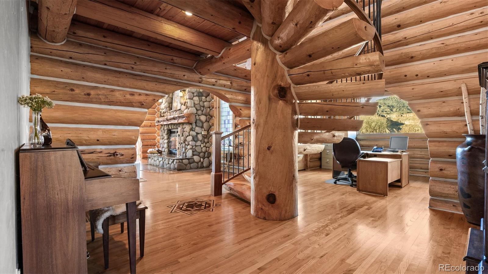 3875 F F 3/4 Road Palisade, CO 81526 - Photo 22 of 45 a view of a hallway with wooden floor