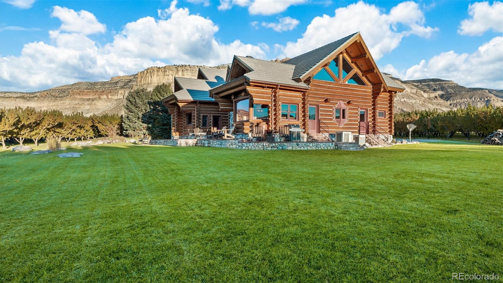 3875 F F 3/4 Road Palisade, CO 81526 - Photo 8 of 45 a view of a big house with table and chairs