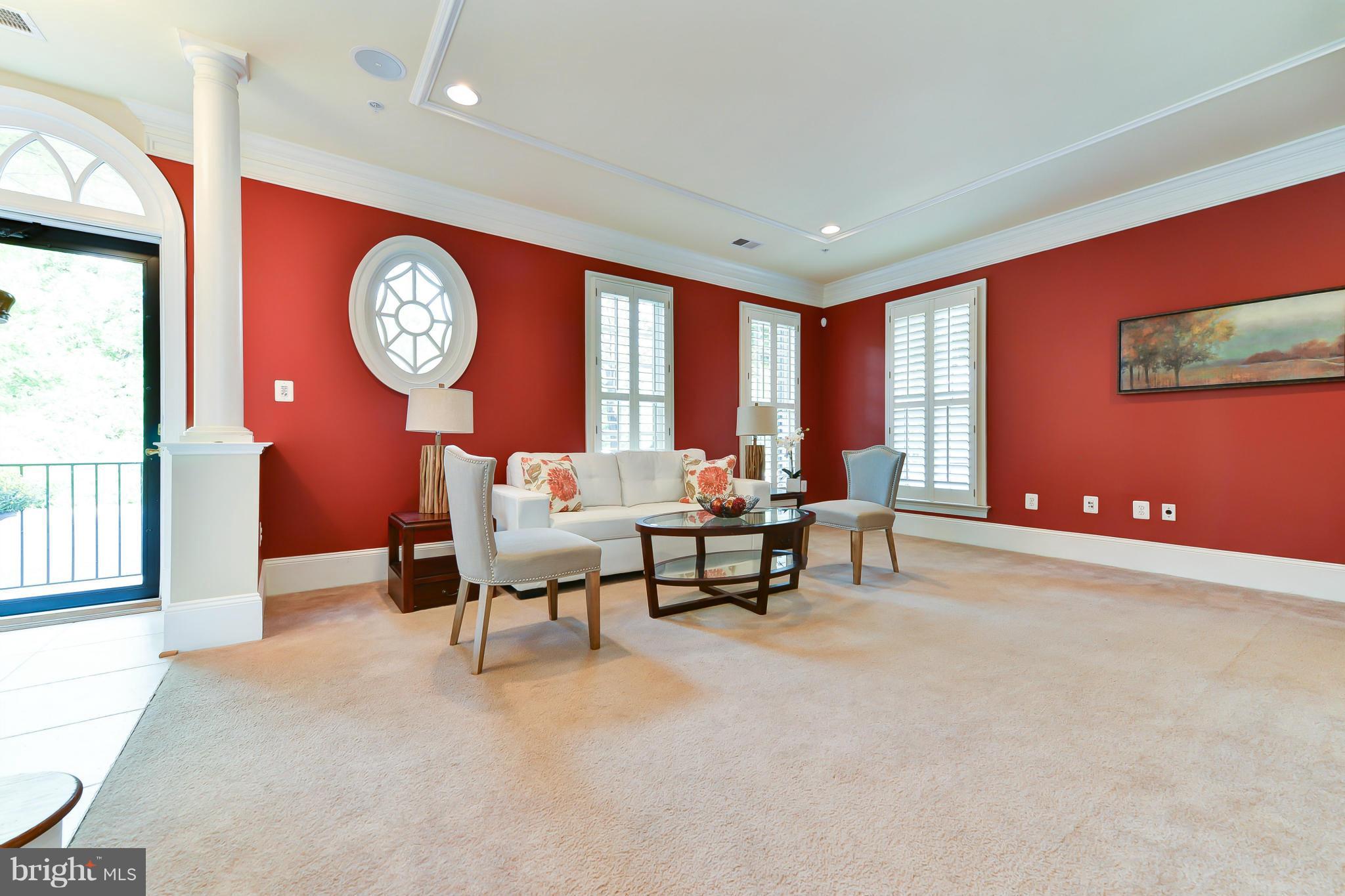 1728 Carpenter Road Alexandria, VA 22314 - Photo 2 of 29 a living room with furniture a table and a large window