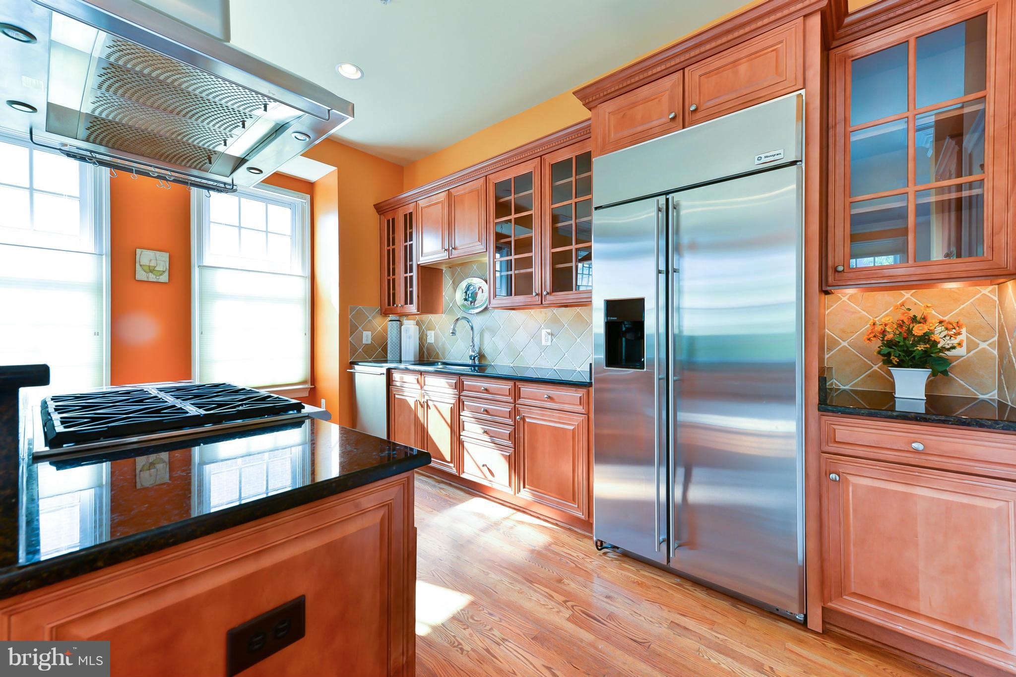 1728 Carpenter Road Alexandria, VA 22314 - Photo 13 of 29 a kitchen with stainless steel appliances granite countertop a refrigerator a oven and a stove