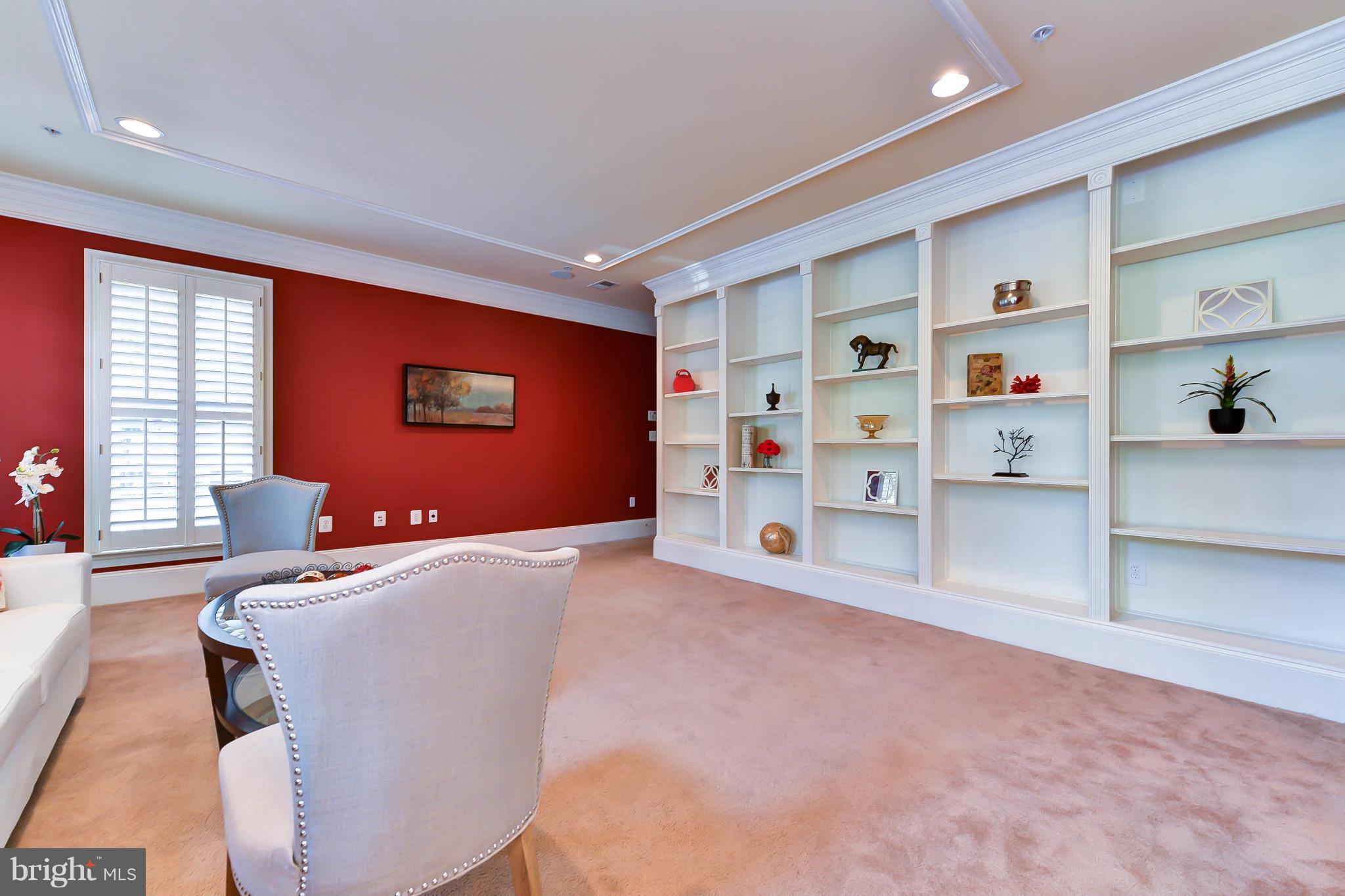 1728 Carpenter Road Alexandria, VA 22314 - Photo 3 of 29 a room with furniture and a flat screen tv