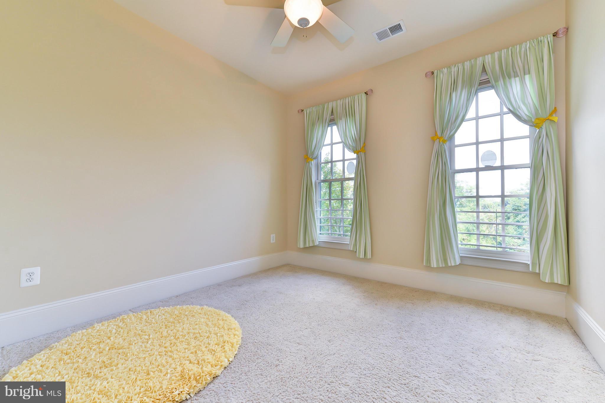 1728 Carpenter Road Alexandria, VA 22314 - Photo 22 of 29 an empty room with windows and closet