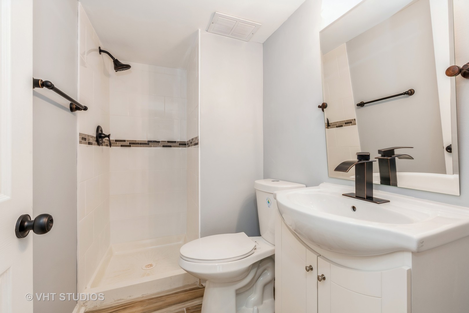 15117 Madison Avenue Dolton, IL 60419 - Photo 11 of 14 a bathroom with a sink toilet and shower