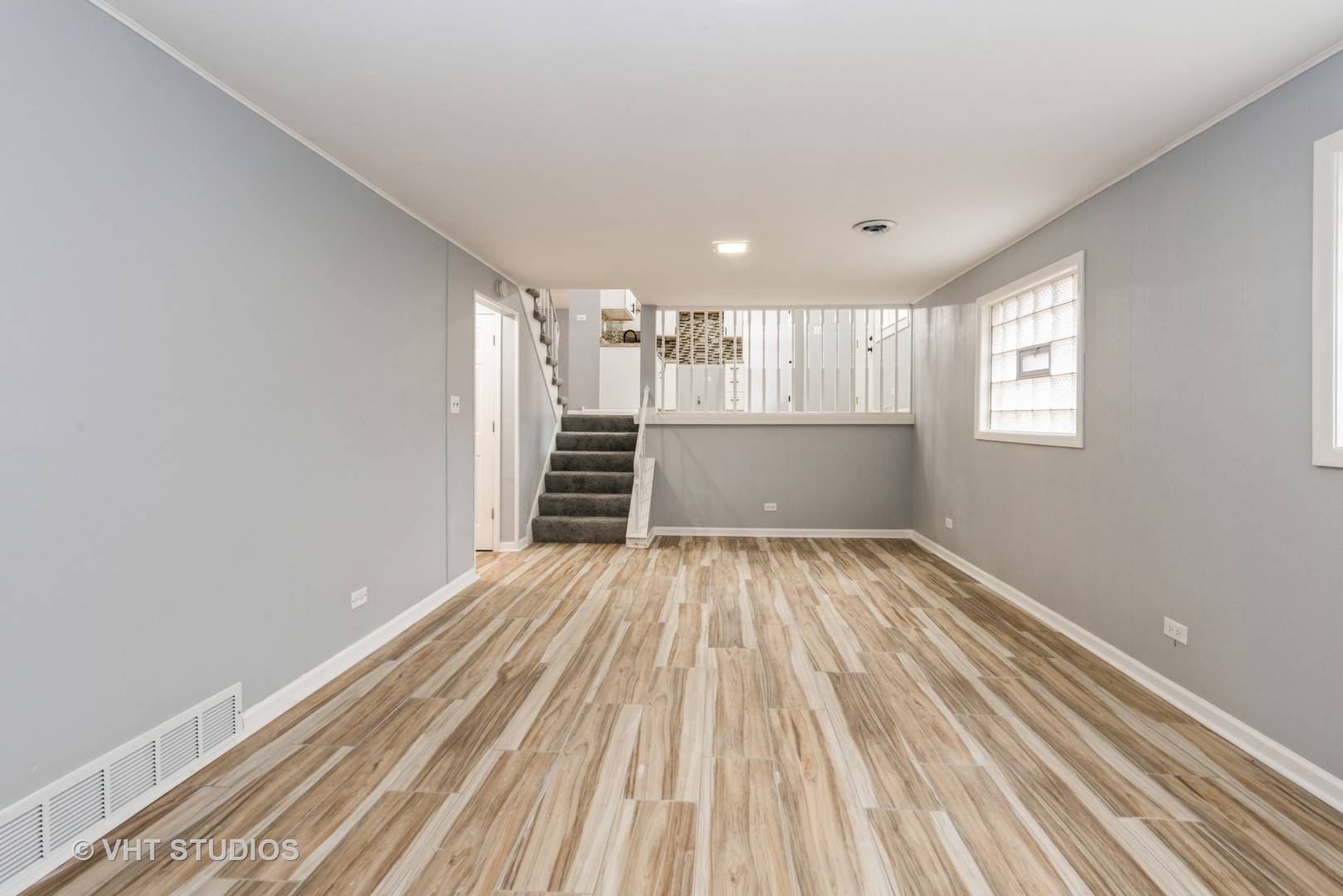 15117 Madison Avenue Dolton, IL 60419 - Photo 12 of 14 wooden floor in an empty room with a window