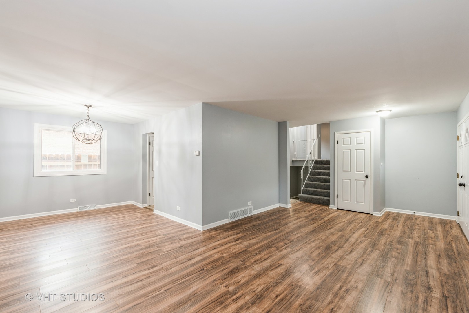 15117 Madison Avenue Dolton, IL 60419 - Photo 2 of 14 a view of an empty room with wooden floor