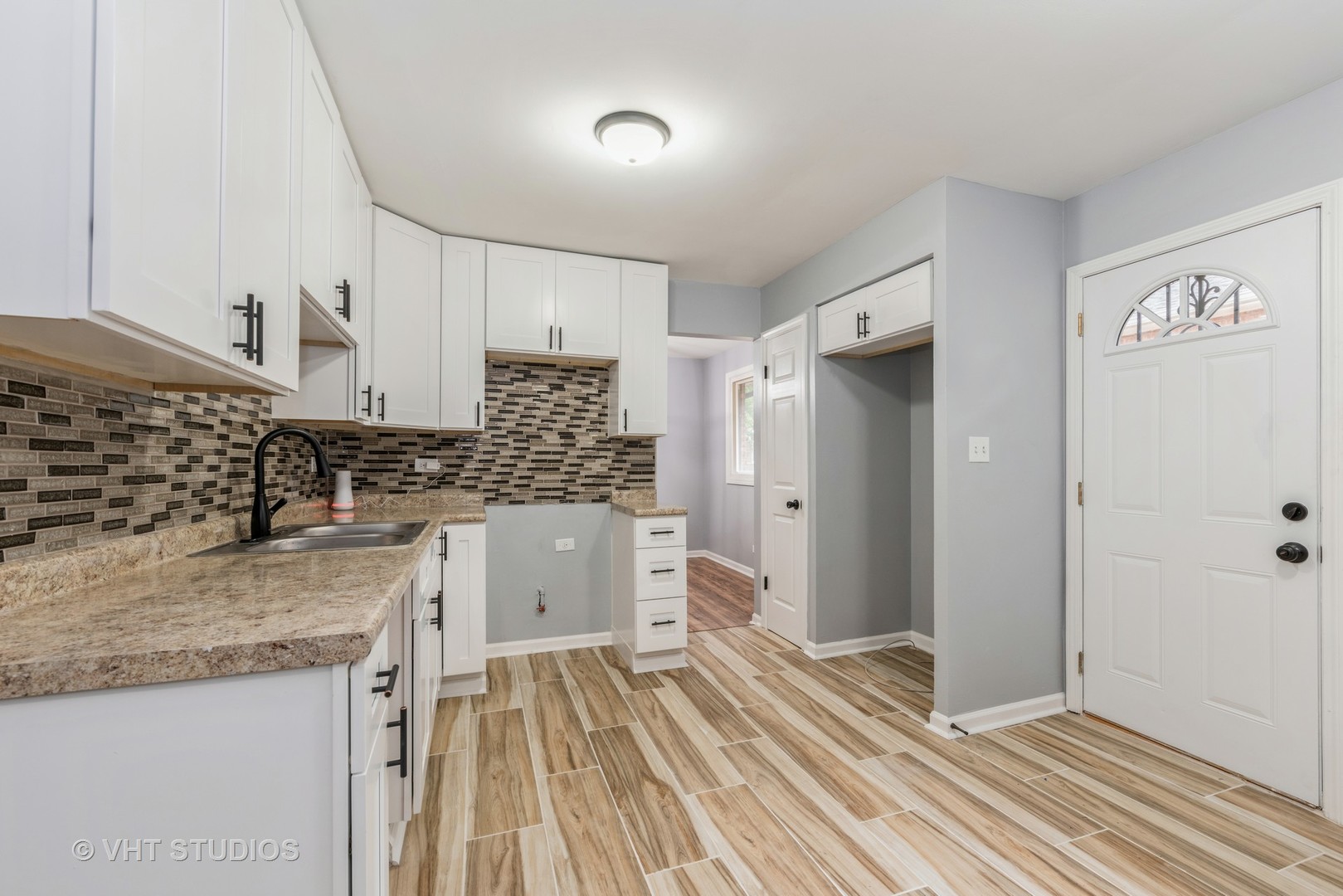 15117 Madison Avenue Dolton, IL 60419 - Photo 4 of 14 a kitchen with a sink and refrigerator
